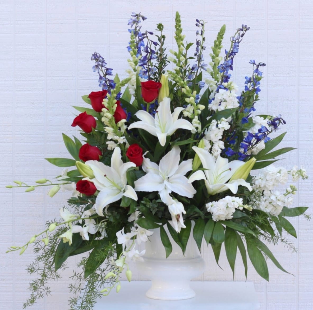 Dearly Patriotic - Floral Display - An elegant display of patriotic beauty to honor your loved one. 