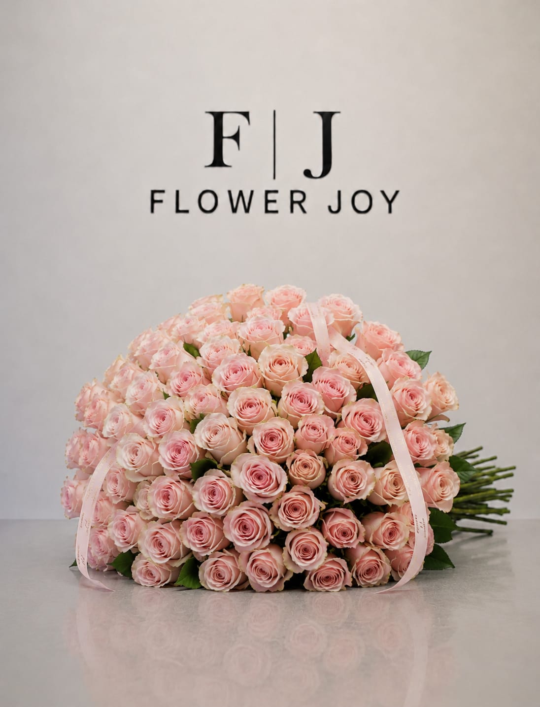 Blush Romance Bouquet (75 Roses) - A graceful arrangement of soft blush-pink roses, hand-tied with delicate ribbon details. Elegant, romantic, and timeless, perfect for birthdays, anniversaries, congratulations, or a thoughtful surprise.