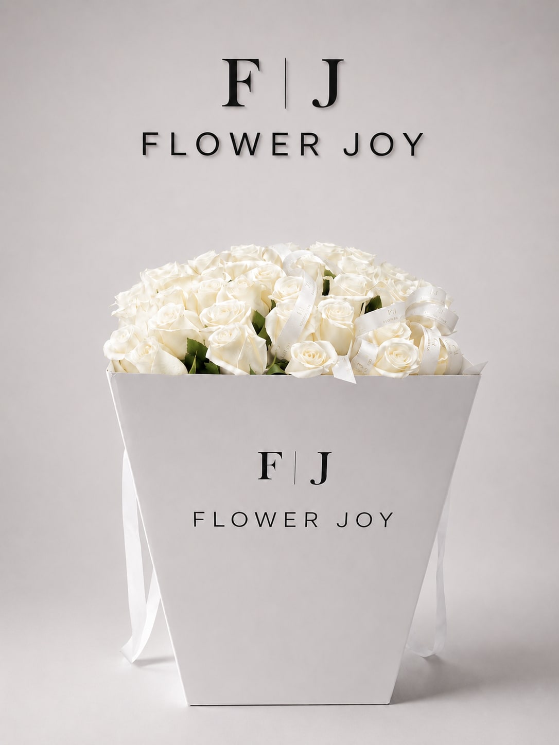 Ivory Rose Gift Box - A timeless arrangement of fresh white roses, elegantly presented in a signature Flower Joy box and finished with delicate ribbon details. Pure, refined, and luxurious, perfect for weddings, anniversaries, sympathy gestures, or meaningful celebrations.