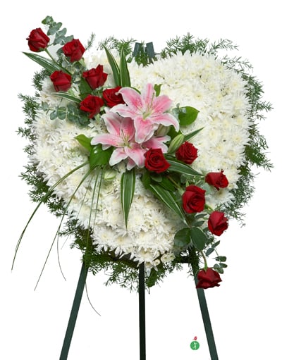 Standing floral spray with white flowers, red roses, and pink lilies
