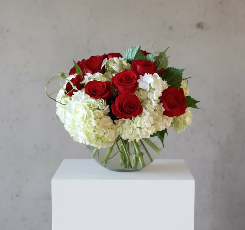  Our Love Eternal - The Our Love Eternal Bouquet is a symbol of unending love and affection.. Brilliant red roses  pop against a bed of white hydrangea simply accented with stems of  ivy and beautifully arranged in a clear glass vessel to create a wonderful way to convey your deepest sentiments.