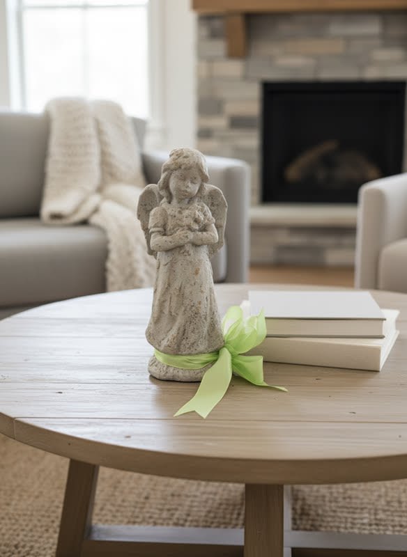 Aged Stone like Angel with flowers - Sweet aged concrete angel holding a sweet bouquet in it's hands. Sweet memorial for the loved one in your life. Perfect for home, garden or screened porch. Approx 13x5.5 Delivered as seen with a bow and your card with sentiment tied to it.