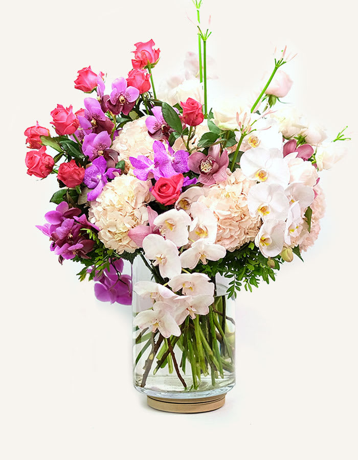           My All bouquet -  You mean the world to me!  If there's someone in your life who you simply could not live without, sending this bouquet is sure to tell them A voluptuous swathe of rich hydrangea and exotic orchids in contrasting statement pinks.  This bouquet must be ordered 1 days in advance to allow time for us to order the freshest flowers