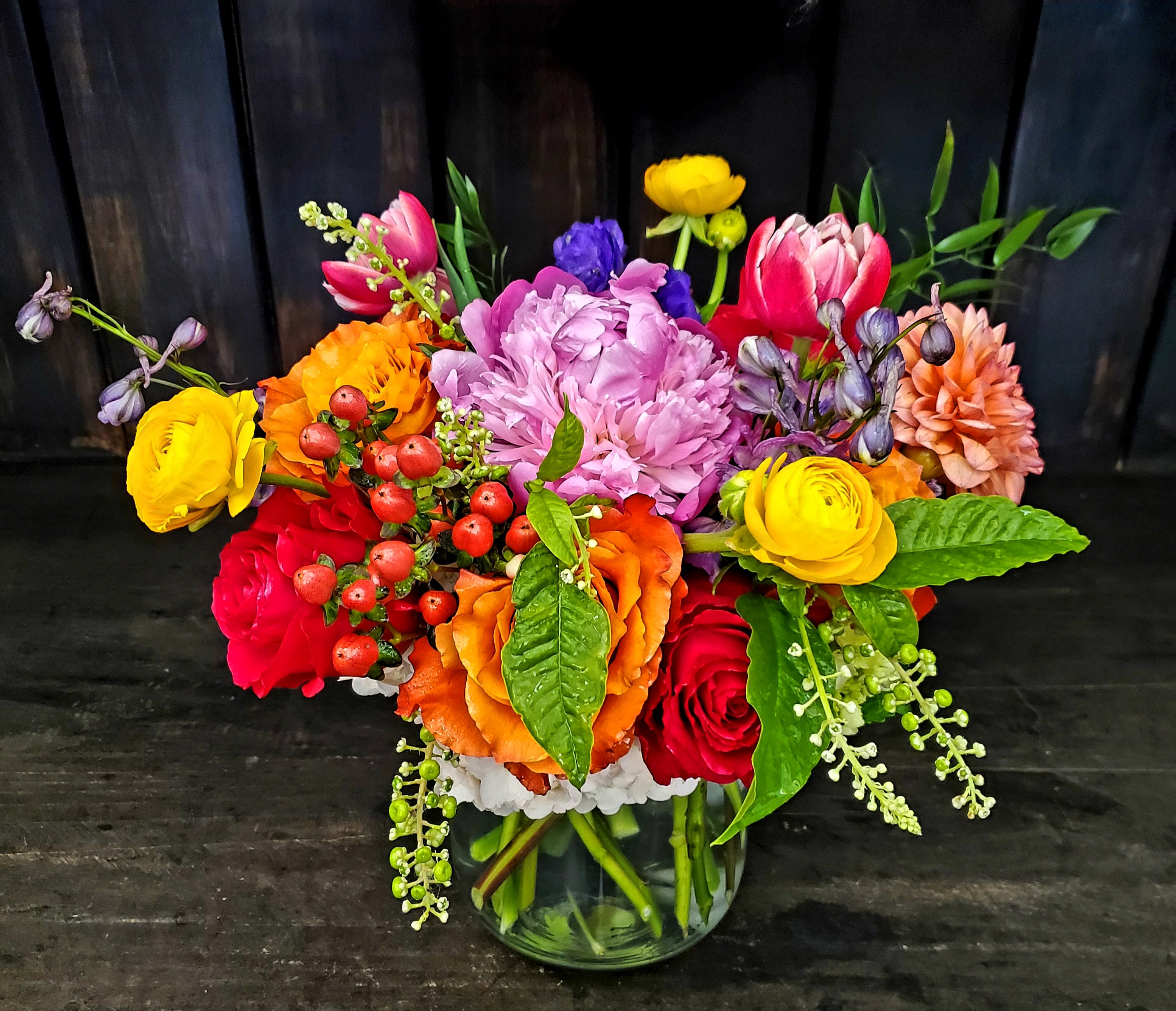 Colorful mixed bouquet in a clear glass vase