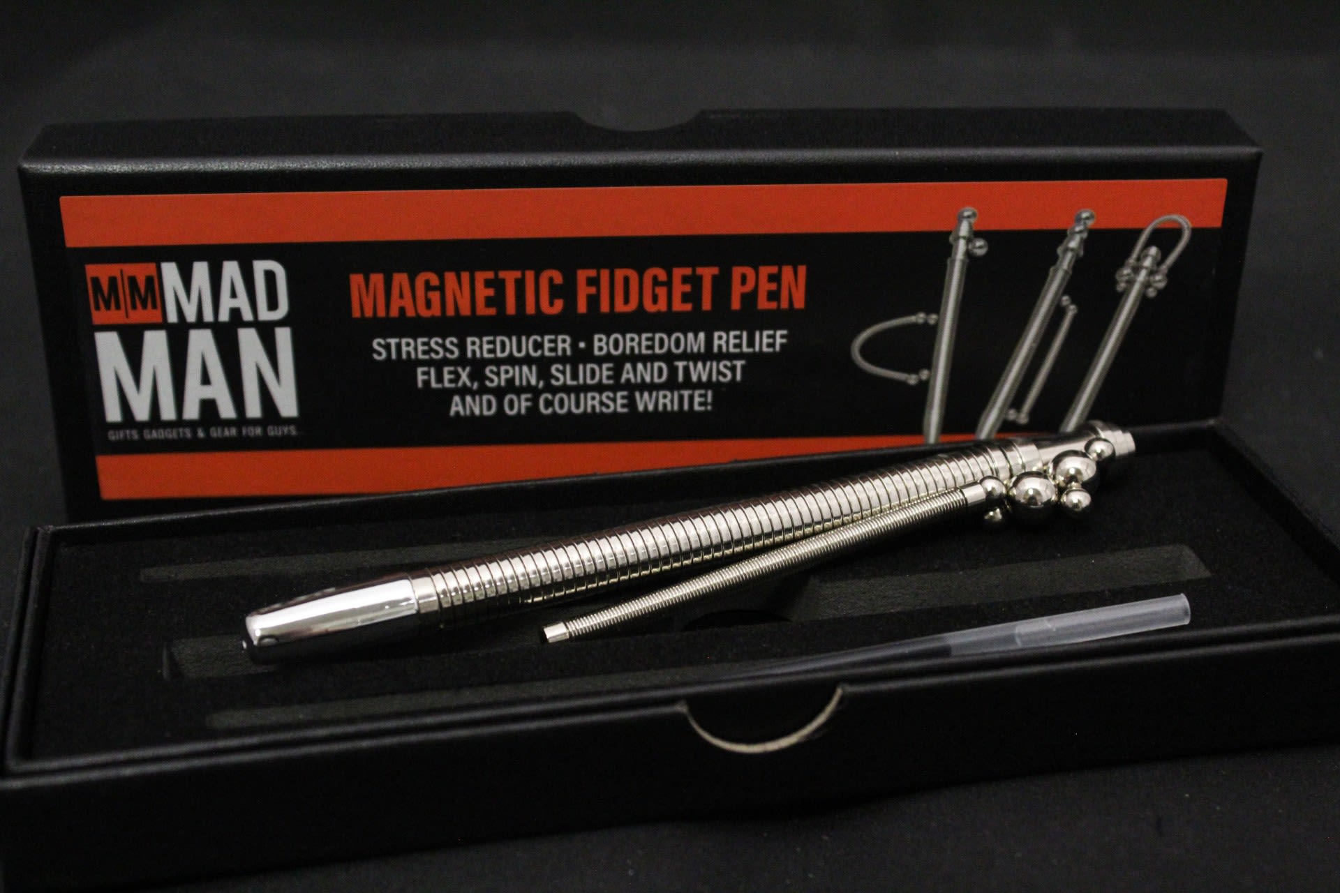 Magnetic Fidget Pen - A sleek, gadget-style gift for the person who likes to fidget thoughtfully - presented as a boxed magnetic fidget pen set perfect for casual gifting or a small desk surprise. This boxed pen set works well as a novelty gift for birthdays, coworker thank-yous, or a little something for someone who appreciates tactile desk accessories; it reads confidently masculine and modern while still feeling polished enough for everyday use.  The pen's mechanical, modular look gives it weight and texture in the hand; the included refill keeps it ready for writing or prolonged desk play. Compact and gift-ready, it's an attractive small present for someone who likes clever, useful objects.  Give this to the colleague who needs a thoughtful desk distraction, a friend who loves novelty tools, or anyone who enjoys a tactile, well-made pen. The set ships in its presentation box and includes the pen, magnetic components, and one refill.