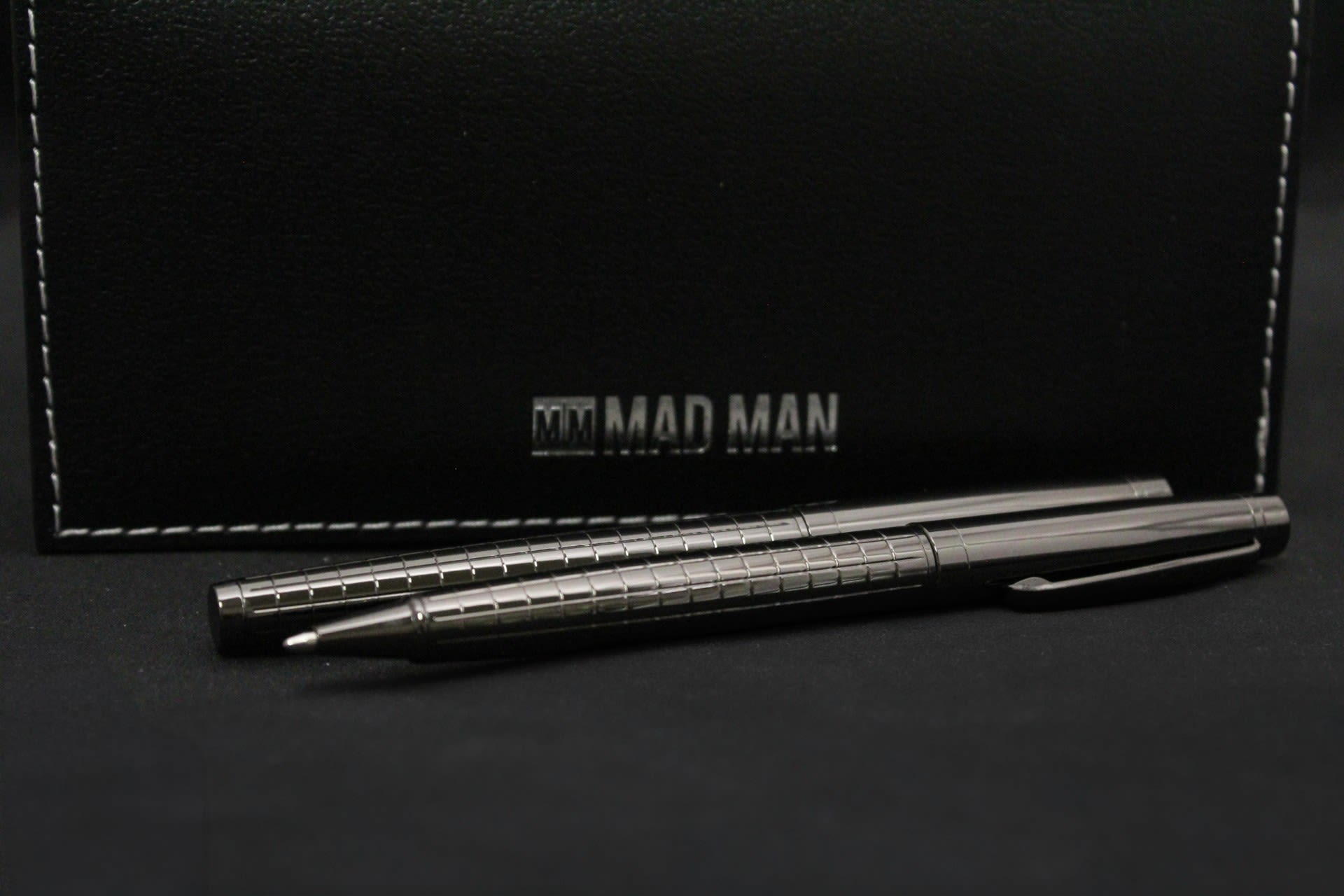 Gunmetal Pen Set - Sleek metallic pens presented in a black case make this gift-ready pen set ideal for graduation, retirement, or a professional thank-you. The formal, masculine look sends a clear message of respect and appreciation-the kind of gift that makes the recipient feel acknowledged for their achievement or service.  Two reflective gunmetal pens, . The set's compact profile fits easily into a briefcase or desk drawer; the sturdy case protects the pens and keeps the presentation neat for gifting.  Perfect for the colleague, mentor, or graduate who values polished, practical presents-this pen set reads as both thoughtful and useful.