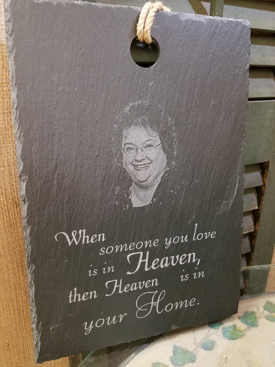 Slate memorial plaque with a portrait and sympathy quote