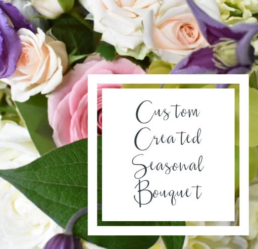 Bouquet of pink, white, and purple flowers with a text card