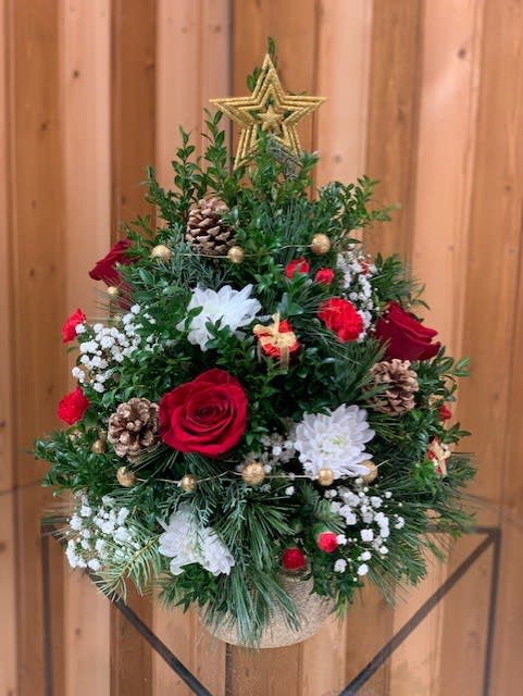 Christmas tree-shaped floral arrangement with red and white flowers