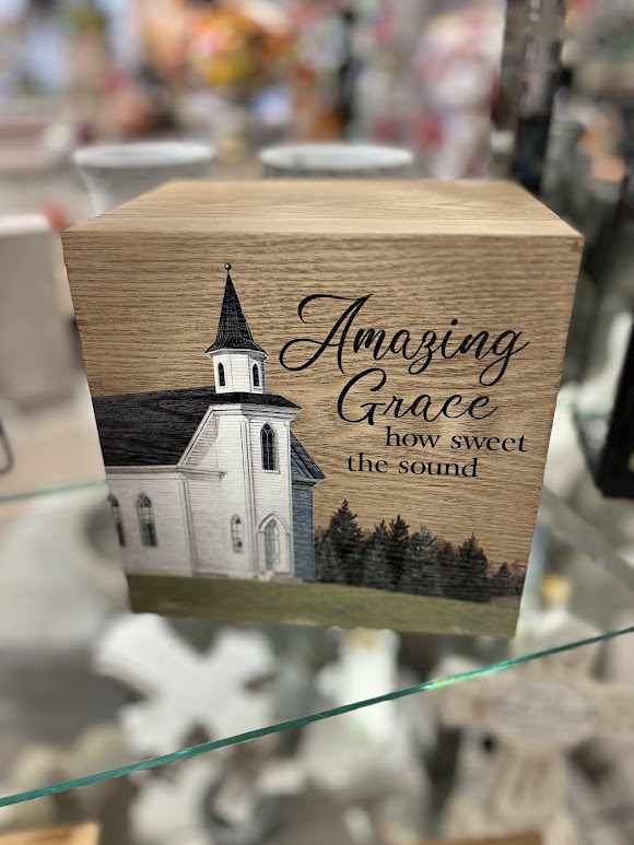 Wooden box with a church illustration and the words "Amazing Grace"