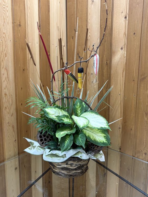 Basket arrangement with assorted green plants and fishing lures