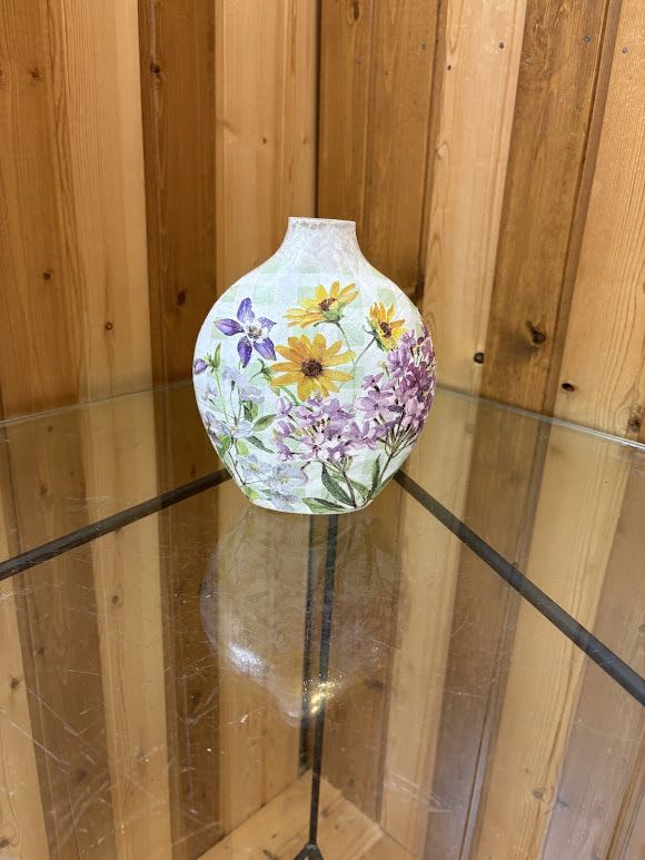Flower Lamp - Beautiful Flower Lamp with Purple Lilac – Radiant Light with Timeless Floral Charm  Bring the beauty of spring indoors with our Beautiful Flower Lamp with Purple Lilac, available exclusively at Haehn Florist &amp; Greenhouses in Wapakoneta, Ohio.  This elegant plug-in accent lamp glows softly through detailed floral panels featuring delicate purple lilac blossoms, symbolizing love, peace, and renewal. The gentle light adds warmth to any room — perfect for home décor, birthdays, or thoughtful sympathy gifts.  Choose your style:   Plain Lamp: A lovely piece on its own, showcasing elegant lilac details and soothing light.   Decorated Lamp with Silk Swag: Enhance your lamp with a custom silk flower arrangement designed by our florists. Choose seasonal or coordinating colors to create a one-of-a-kind keepsake.   Whether displayed in a living room, entryway, or as part of a memorial display, this lamp adds grace and meaning wherever it shines.  Available now at Haehn Florist &amp; Greenhouses  410 Hamilton Rd., Wapakoneta, OH  419-738-8485   Light up your home with the beauty and fragrance of lilacs — forever in bloom.