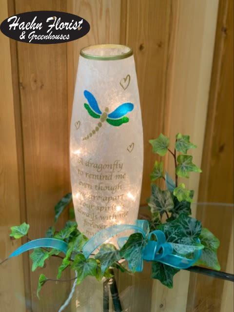 Lit memorial lantern with dragonfly design and ivy garland