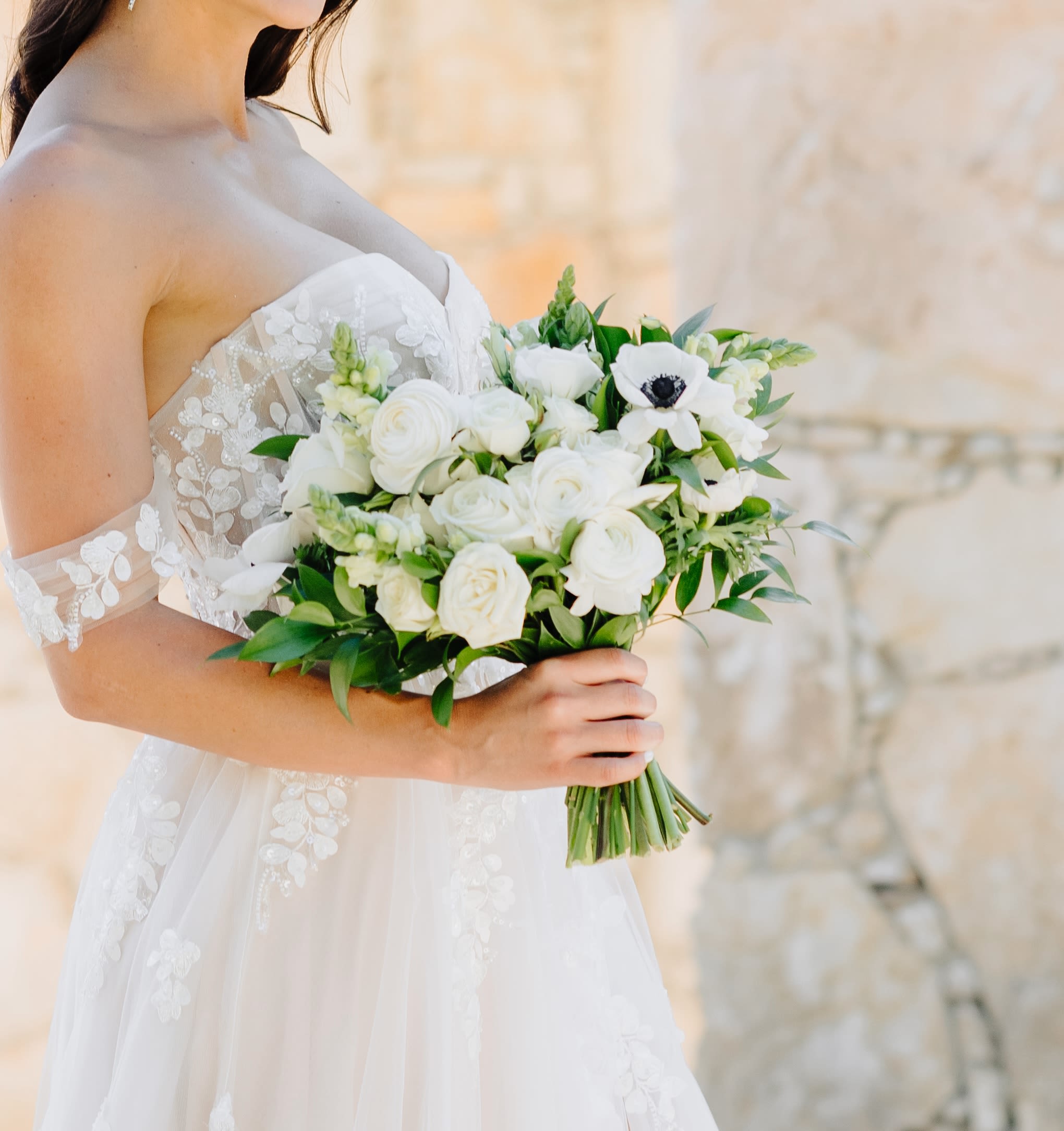 The Elegant Traditions Ceremony Wedding Package - Sophisticated, timeless, and beautifully curated for classic celebrations. Designed for couples who love a refined aesthetic with zero hidden fees, this package covers every detail—including all delivery, professional installation, late-night breakdown, and taxes. ### What’s Included:  The Wedding Party: 1 Classic Bridal Bouquet, 3 Bridesmaid Bouquets, 1 Groom’s Boutonniere, and 3 Groomsmen Boutonnieres. (Add-ons available separately).  Family VIPs: 2 Elegant Wristlets/Corsages and 2 Family Boutonnieres.  The Ceremony &amp; Welcome: 1 Welcome Arrangement for your entrance table, plus 2 Grand Formal Ceremony Arrangements on luxury pillars to elegantly frame your vows.  The Reception: Inclusions for up to 10 tables featuring your choice of elegant small vase arrangements OR romantic bud vase trios, plus simple, fresh cake florals.  The Service Guarantee (Included): Delivery &amp; Set Up: Climate-controlled transport and professional on-site styling of all ceremony, reception, and welcome florals.  Post-Event Strike: Complete late-night breakdown and clean-up after your reception.  Transparent Pricing: All applicable taxes are fully included. No surprise fees at checkout.  Select your color palette below to book. Our design team will contact you to schedule your detailed styling consultation.