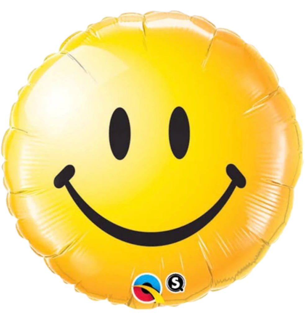 Yellow smiley face foil balloon on a white background