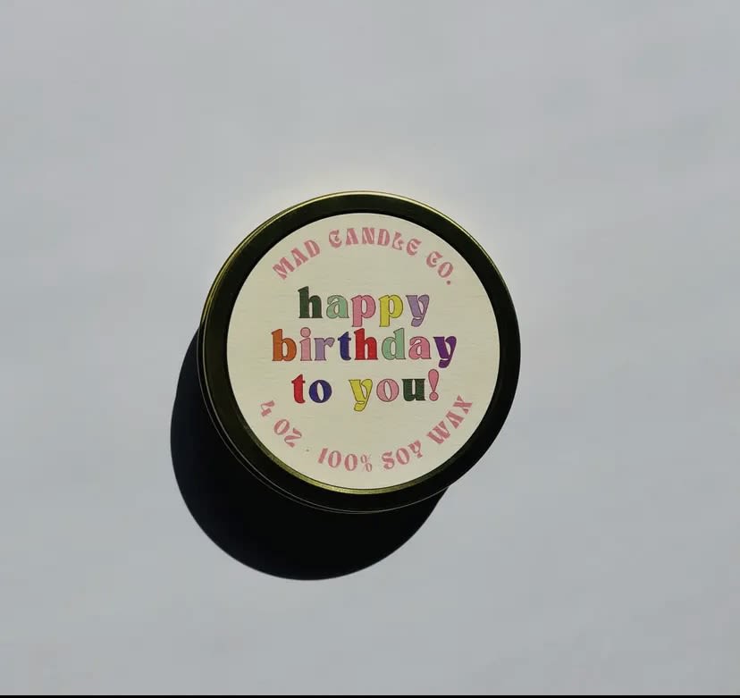 Happy Birthday Soy Candle - 4 oz Gold Tin &amp; Wood Wick - Celebrate any birthday with ease thanks to our “Happy Birthday To You!” candle. With delicious notes of cake batter, vanilla, buttercream, and rainbow sprinkles, it’ll make the recipient feel extra special on their big day.  For an extra festive touch, each candle is topped with a sprinkle of candle-safe rainbow glitter that is biodegradable &amp; made from recycled eucalyptus trees.  Notes: Cake batter, vanilla, buttercream and rainbow sprinkles.  PRODUCT DETAILS -4 oz / Burn time: 15 hours / Dimensions: 3.25" L x 3.25" W x 1.25" H -Sustainable crackling wood wick that sounds like a cozy fireplace -Vegan, Cruelty-free, Non-toxic, Paraben-free &amp; Phthalate-free -Hand-poured in Eugene, Oregon