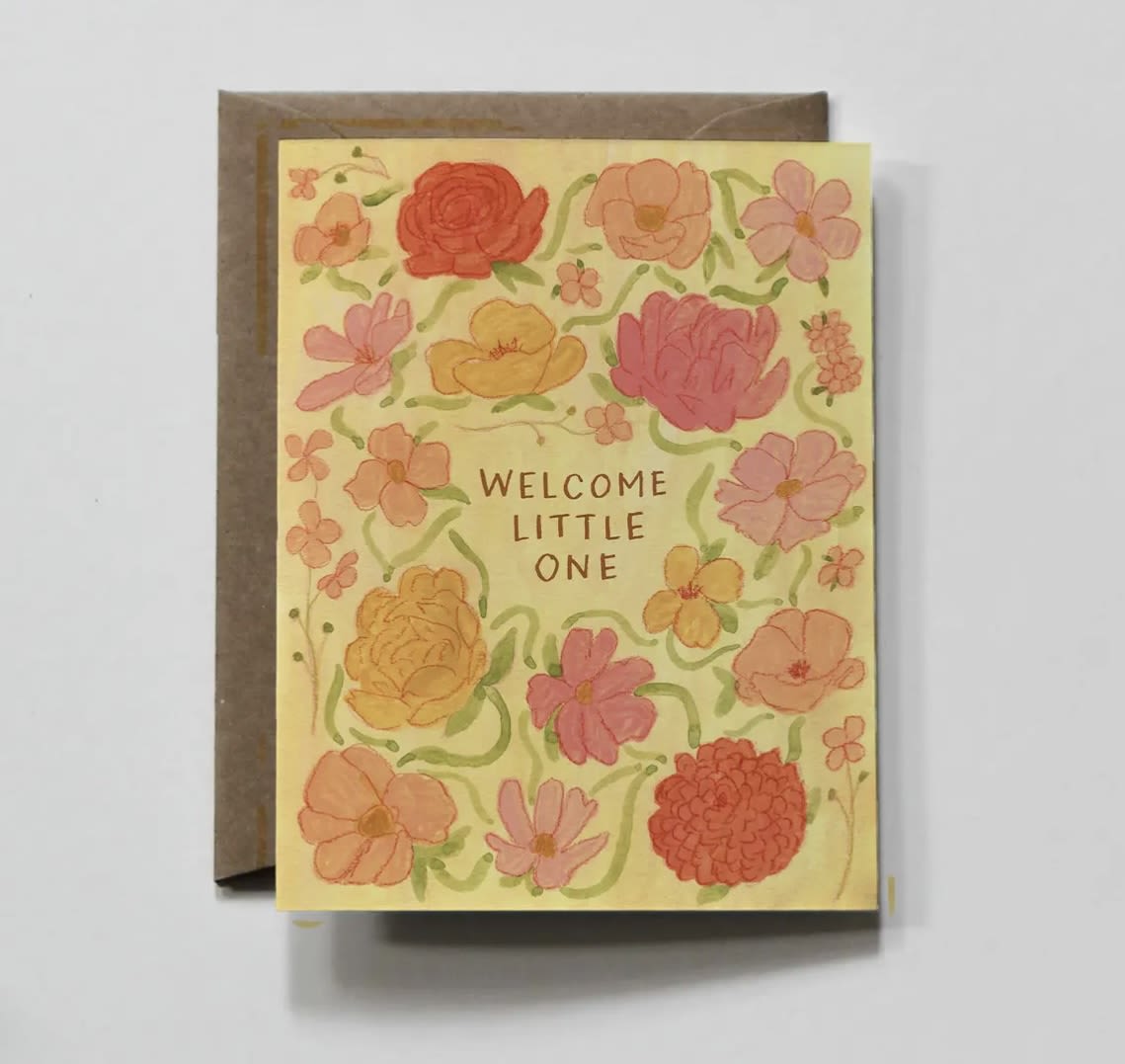 Floral greeting card reading "Welcome Little One"