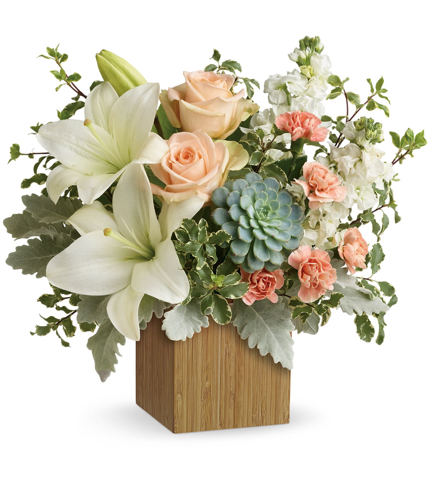 White lilies, peach roses, and pink carnations in a wooden cube vase