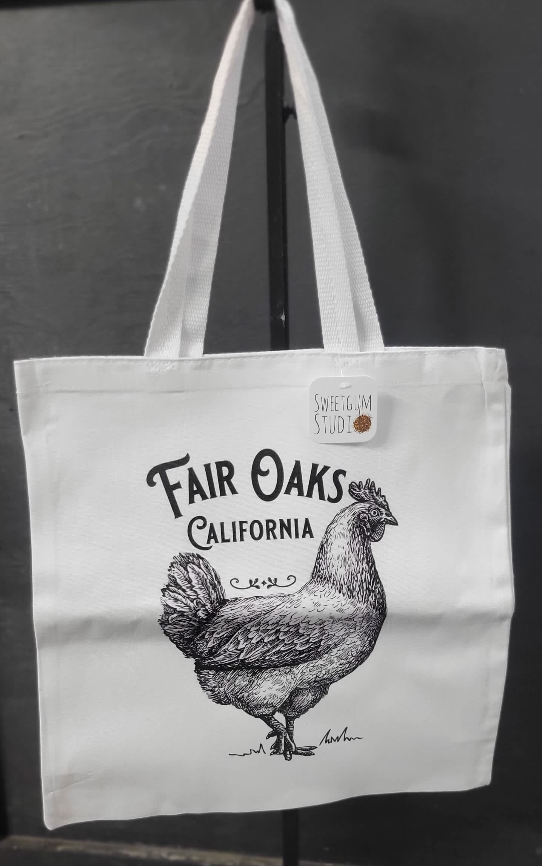 White tote bag with a chicken illustration and Fair Oaks California text