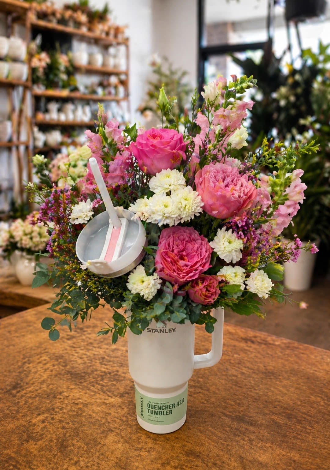 Stanley Cup Flower Arrangement  - This is the ultimate 2-in-1 gift! Available in 30 oz size, each arrangement features a beautiful mix of designer’s choice flowers, carefully selected for their seasonal charm. It’s the perfect combination of practicality and beauty, making it a thoughtful and versatile gift for any occasion.  **Cup Color May Vary**