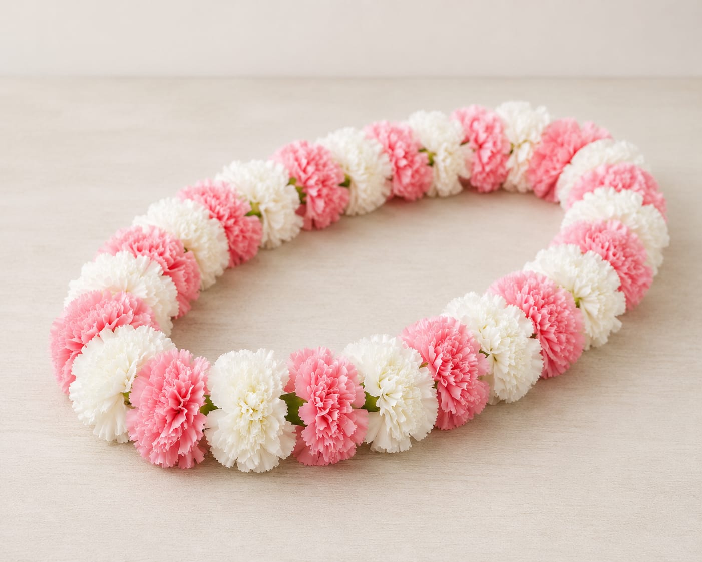 Carnation Lei - Handcrafted Carnation Lei - Price includes 1 to 2 colors of carnations, such as white, pink, yellow, orange, and purple. **Please specify colors in special instructions** PLEASE ALLOW 48 HOURS NOTICE - IF YOU NEED SOONER PLEASE CALL THE STORE TO CONFIRM
