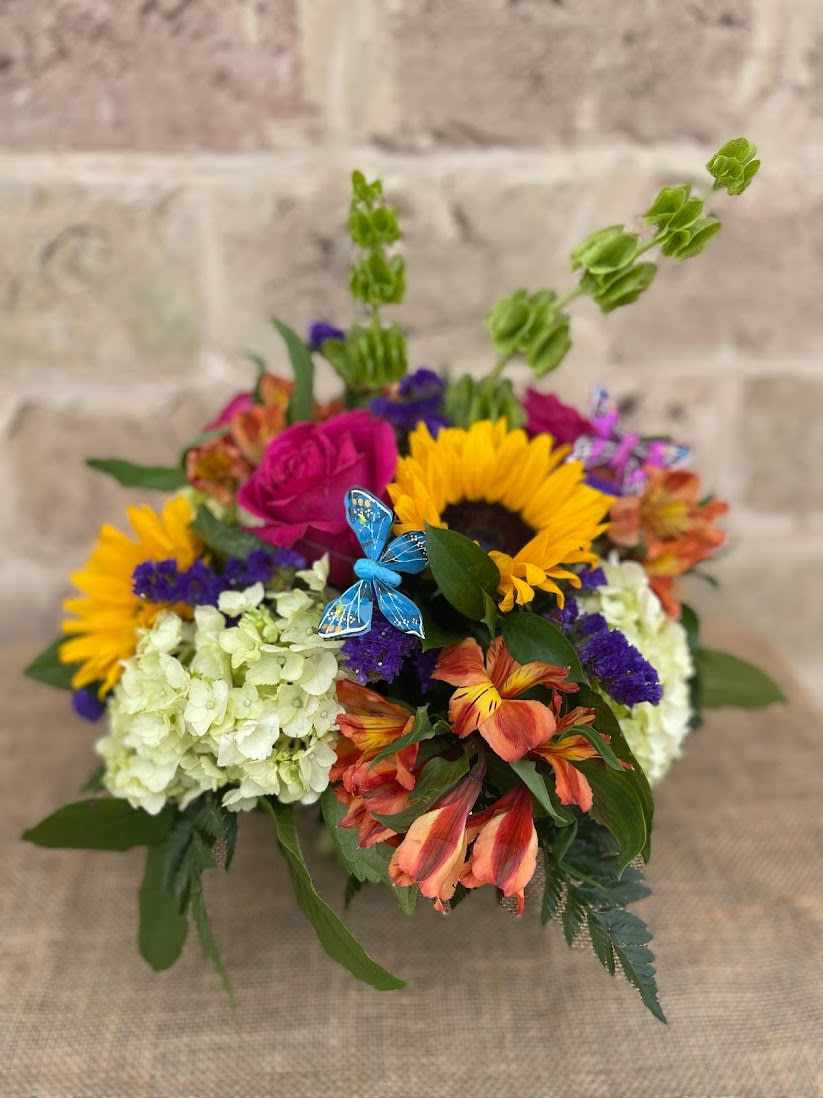 Colorful bouquet with sunflowers, roses, hydrangeas, and orange lilies