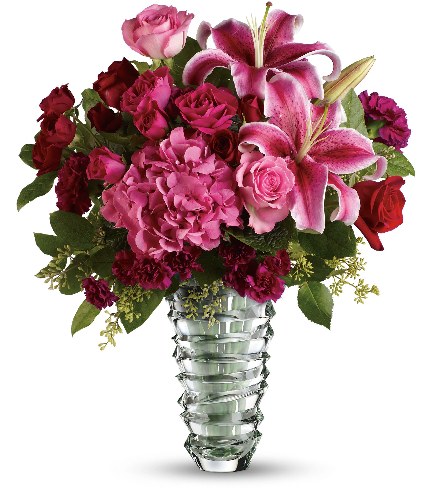 Pink and red floral arrangement in a clear glass vase