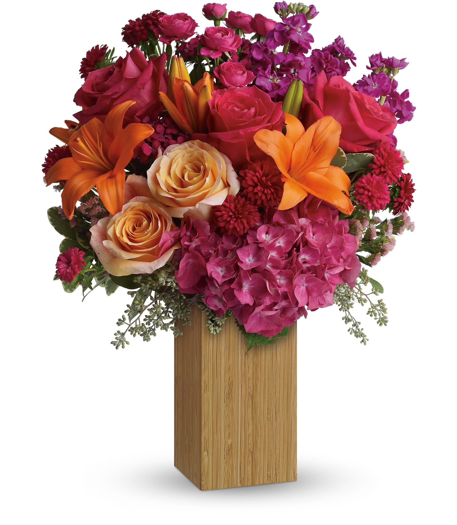 Teleflora's Fuchsia Fantasy - Fabulous! Hot pink flowers are mixed with sunny orange blooms to warm her heart and tickle her fancy. Perfect for birthdays -or any day you want to make her feel extra special.  