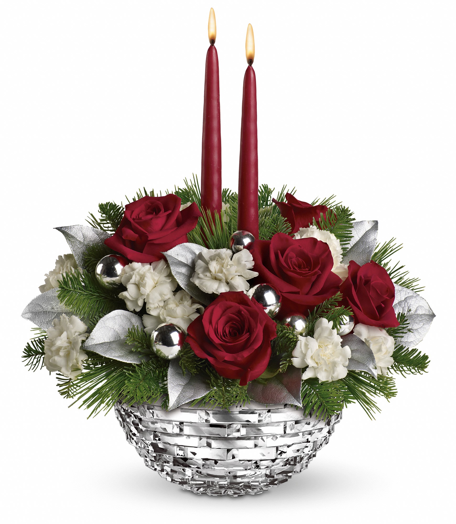 Teleflora's Sparkle of Christmas Centerpiece - Red roses, white miniature carnations, lemon leaf and tips of white pine and noble fir are adorned with festive silver balls and red candles. Delivered in a Sparkle of Christmas glass bowl. Approximately 13 1/2" W x 15" H. T12X100A