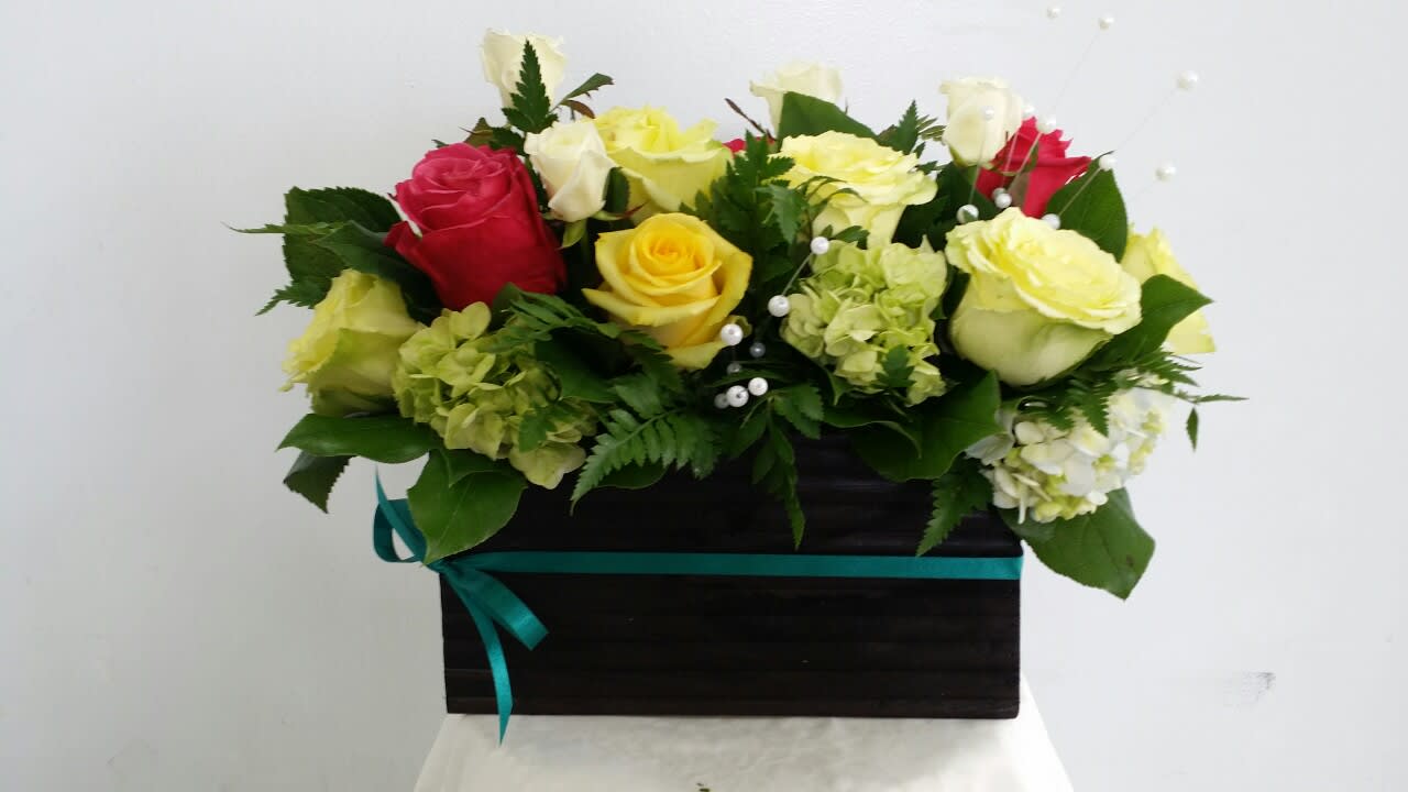 Mixed roses and hydrangeas in a black box with a teal ribbon