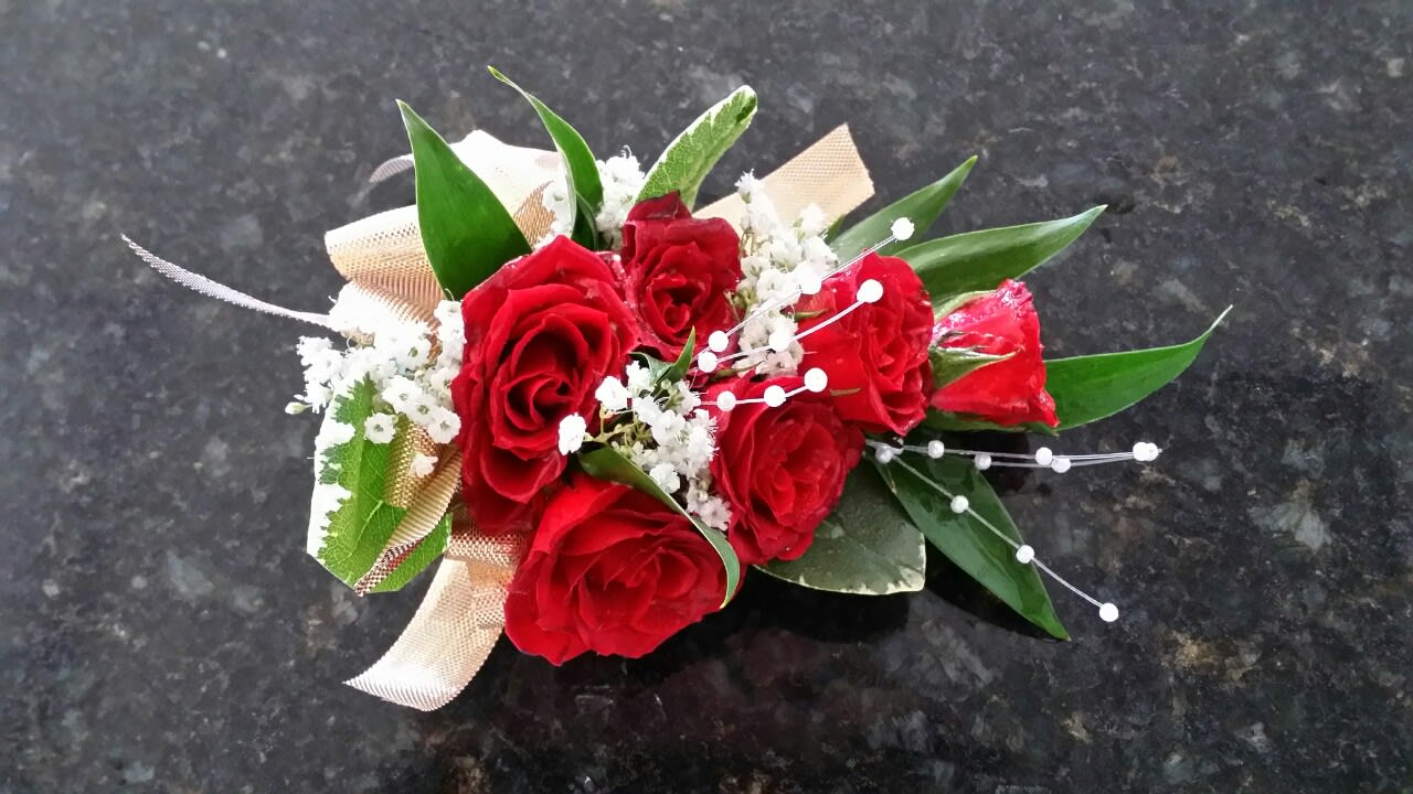 Red rose bouquet with white baby's breath and ribbon