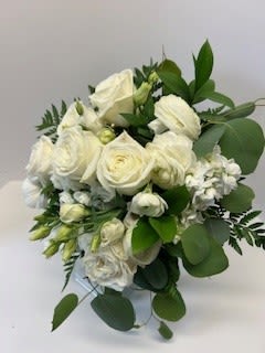 White rose bouquet with green foliage