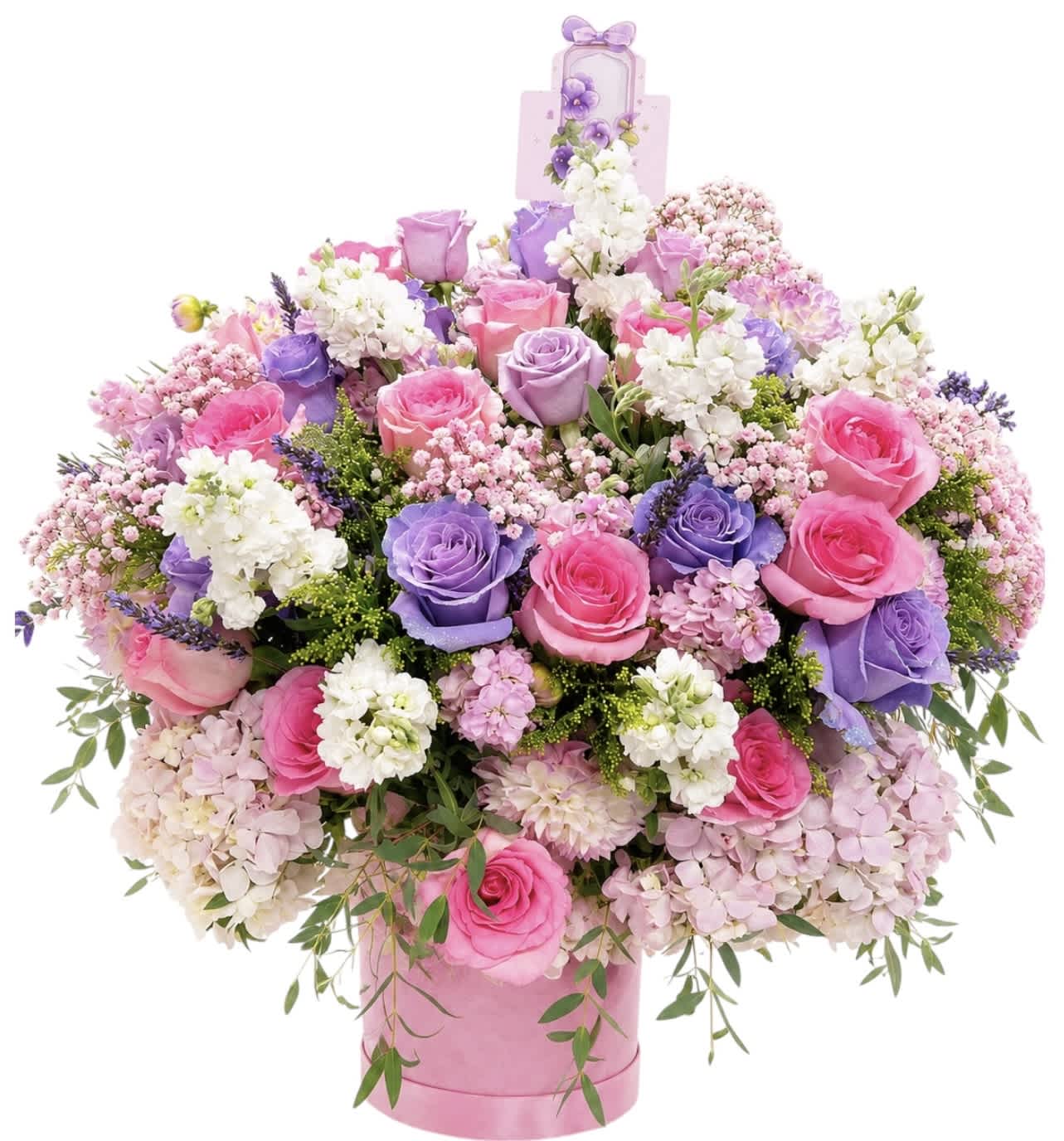 Large bouquet of pink and purple roses in a pink hatbox