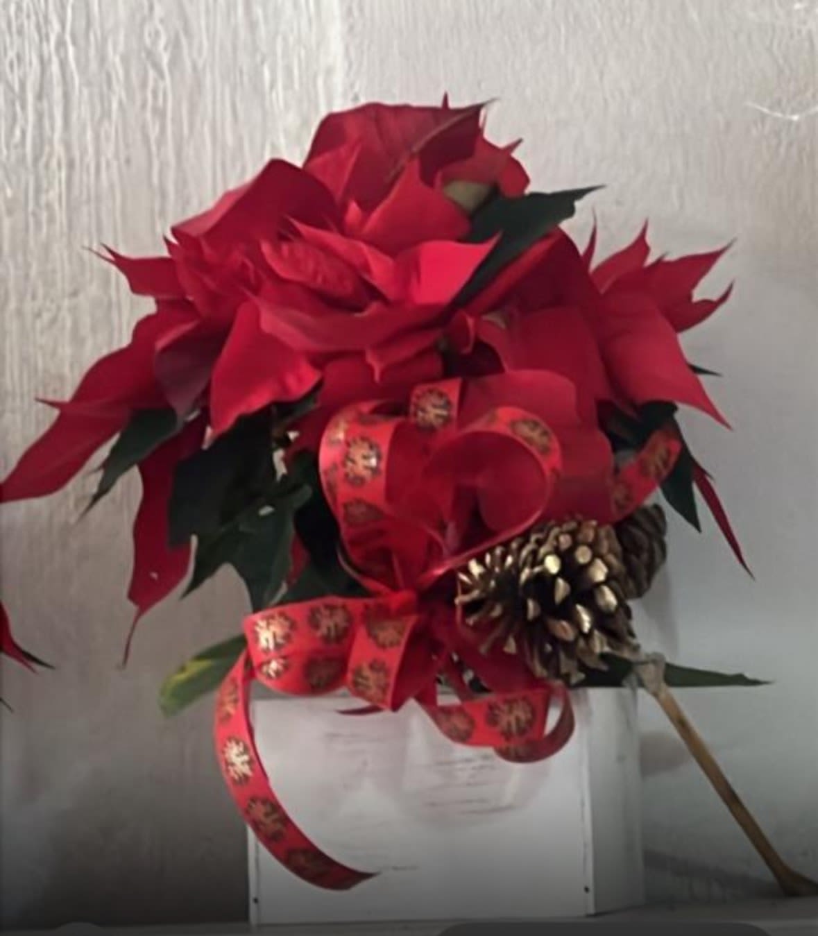 Scarlet Celebration - Seasonal flower arrangement crafted with fresh red poinsettias, festive greenery and natural pine accents, professionally designed as a Christmas floral centerpiece in a handcrafted with care.