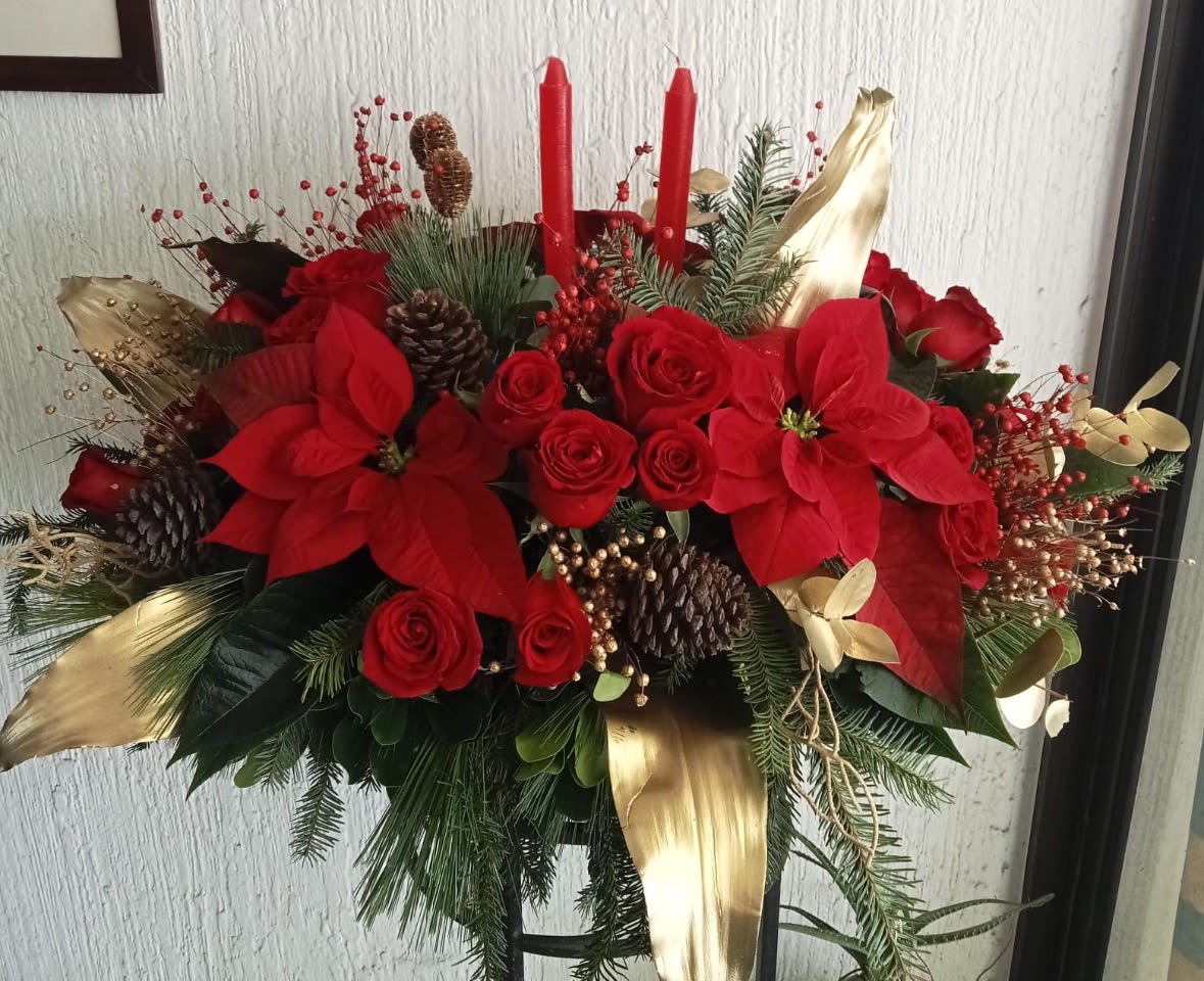 Golden Noel Glow - Premium Christmas floral centerpiece designed with fresh red poinsettias, white lilies and seasonal greenery, professionally designed as a luxury holiday flower arrangement for home decor and special celebrations handcrafted with expert care.