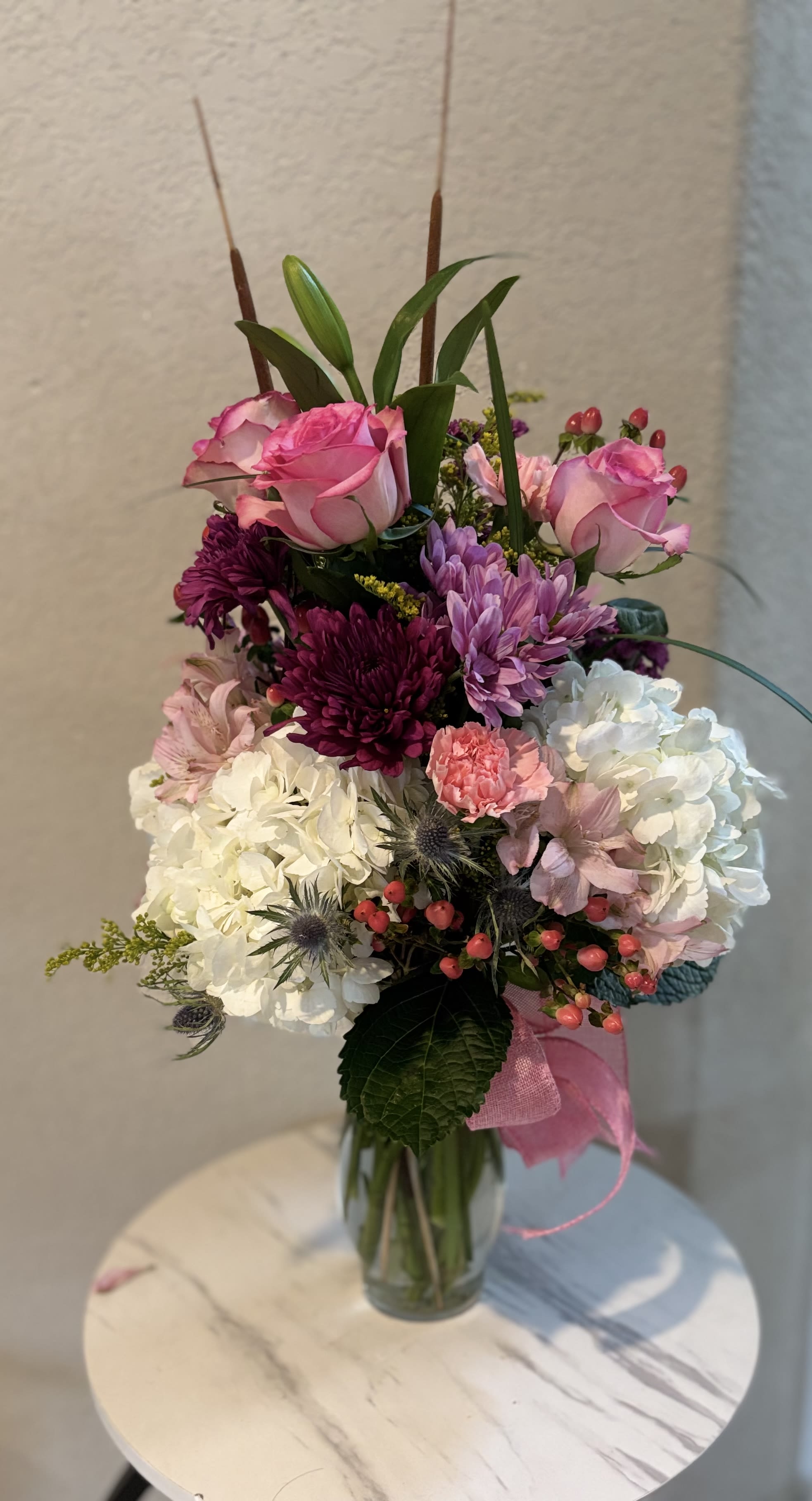 Blush and Bloom Arrangement - This elegant garden vase arrangement features fresh pink roses, hydrangeas, chrysanthemums and seasonal blooms designed in a tall glass vase. Perfect for birthdays, anniversaries, sympathy or special celebrations. Handcrafted by Snyder Flowers, a trusted local florist in San Antonio, offering same day flower delivery.