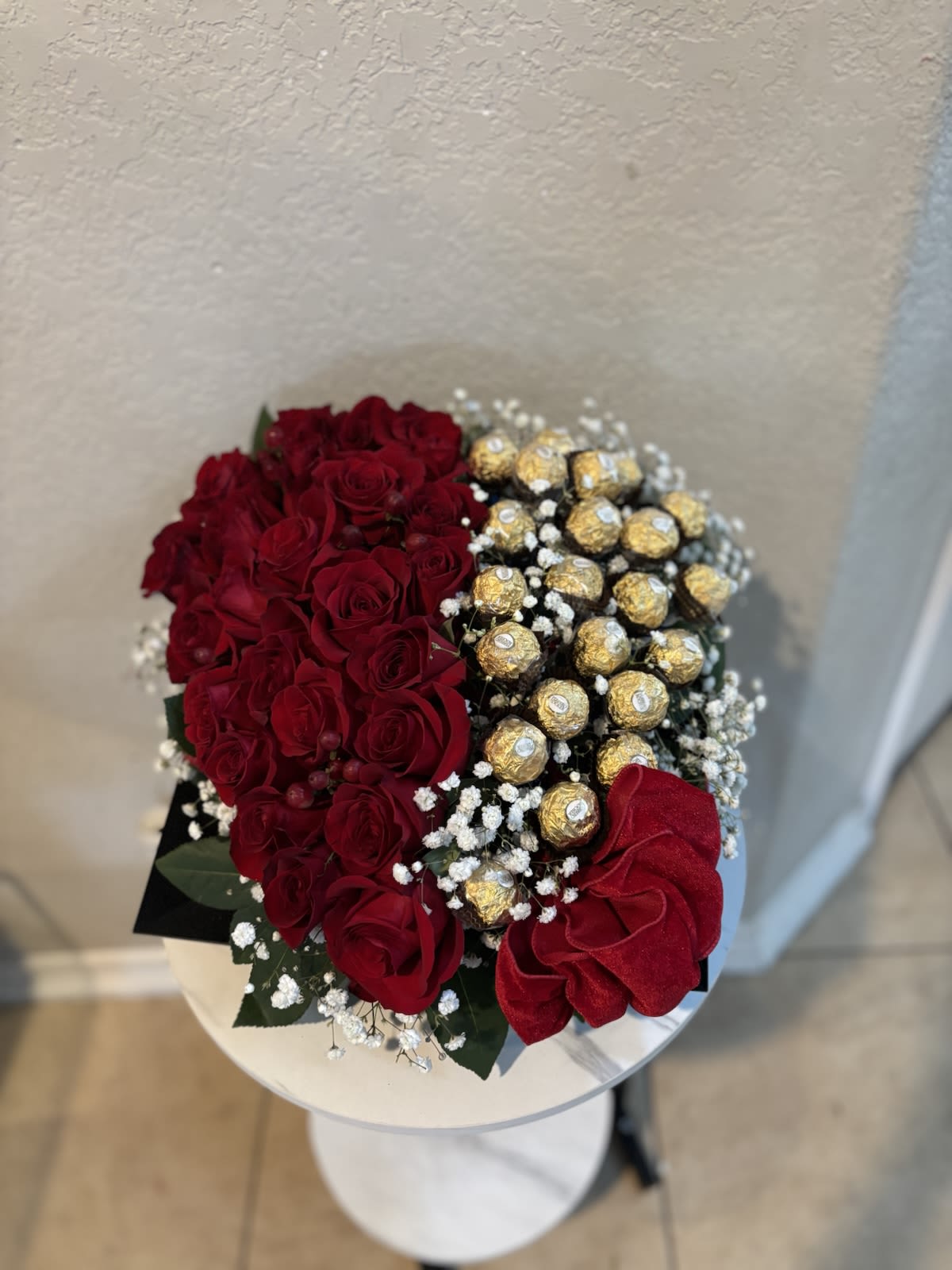 Luxury Red heart roses and Ferrero Bouquet - This elegant floral arrangement from Snyder Flower in San Antonio, features 24 premium red roses paired with Ferrero chocolates. Designed by professional florists, is perfect for anniversaries, Valentine´s Day, Birthdays or romantic surprises. Each rose is selected for freshness, beauty and long lasting quality, creating a stunning presentation. Our experienced team takes pride in offering reliable same day flower delivery in San Antonio and surrounding areas, ensuring your gift condition.