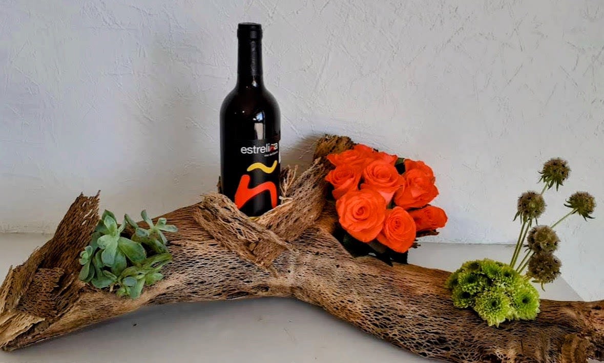 Rustic Sunset Roses &amp; Wine Gift - Looking for a unique gift in San Antonio? Our Rustic Sunset Roses &amp; Wine Gift combines premium orange roses, fresh succulents, seasonal flowers, rustic wood accents, and an elegant wine-inspired presentation. This custom-designed arrangement is perfect for anniversaries, birthdays, romantic surprises, congratulations, retirement celebrations, Father's Day, housewarming gifts, thank you gifts, and special occasions. Handcrafted by Snyder Flowers, we proudly provide same-day flower delivery and gift delivery throughout Stone Oak, Alamo Heights, Shavano Park, The Dominion, Medical Center, Helotes, Bulverde, Schertz, Cibolo, and surrounding San Antonio communities. Every design is created with fresh flowers and attention to detail, making each gift truly memorable.