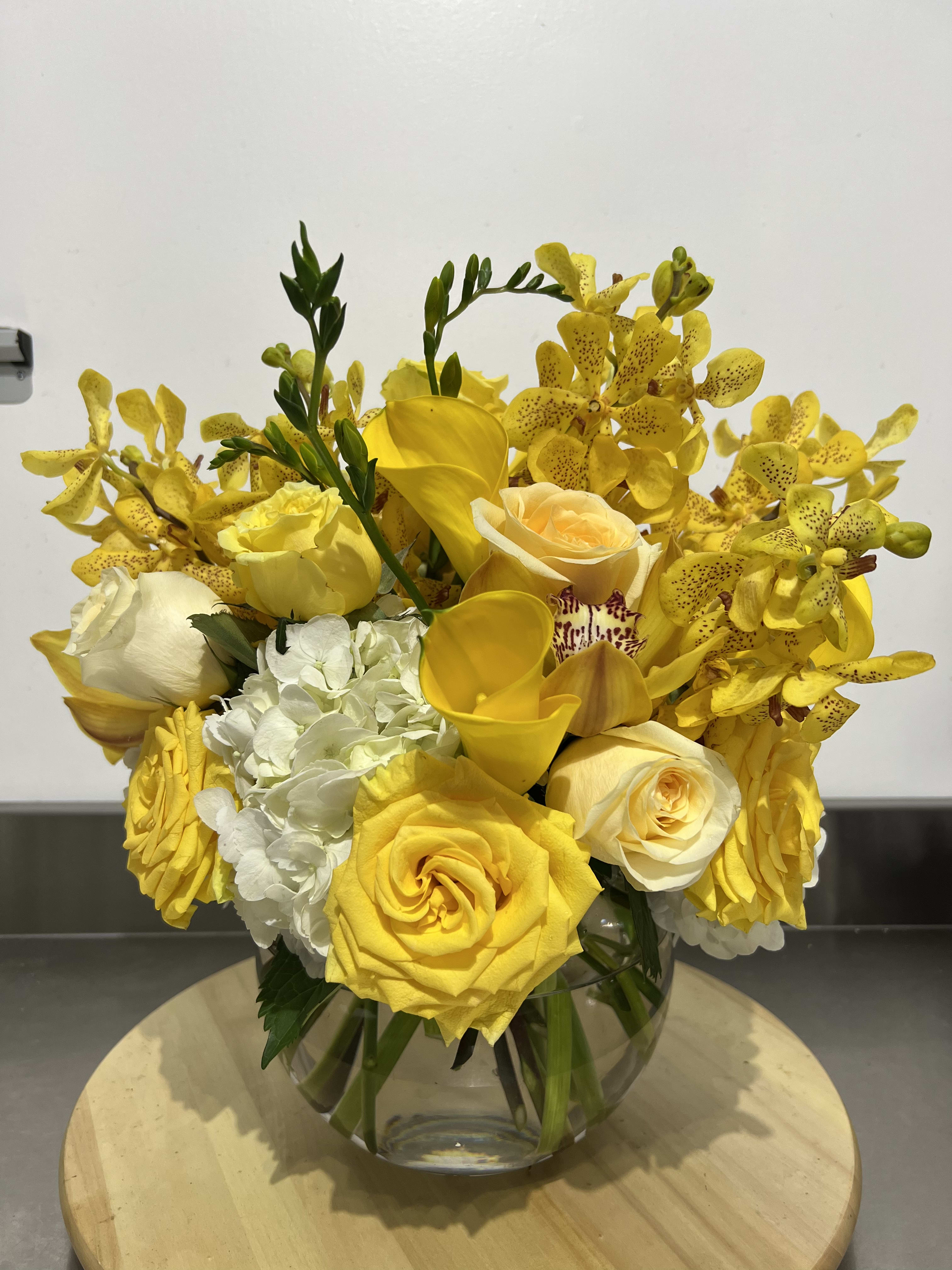 Yellow it’s me  - A bubble bowl fillies with gorgeous yellow blooms, mini calla lily, roses, hydrangea and orchids 