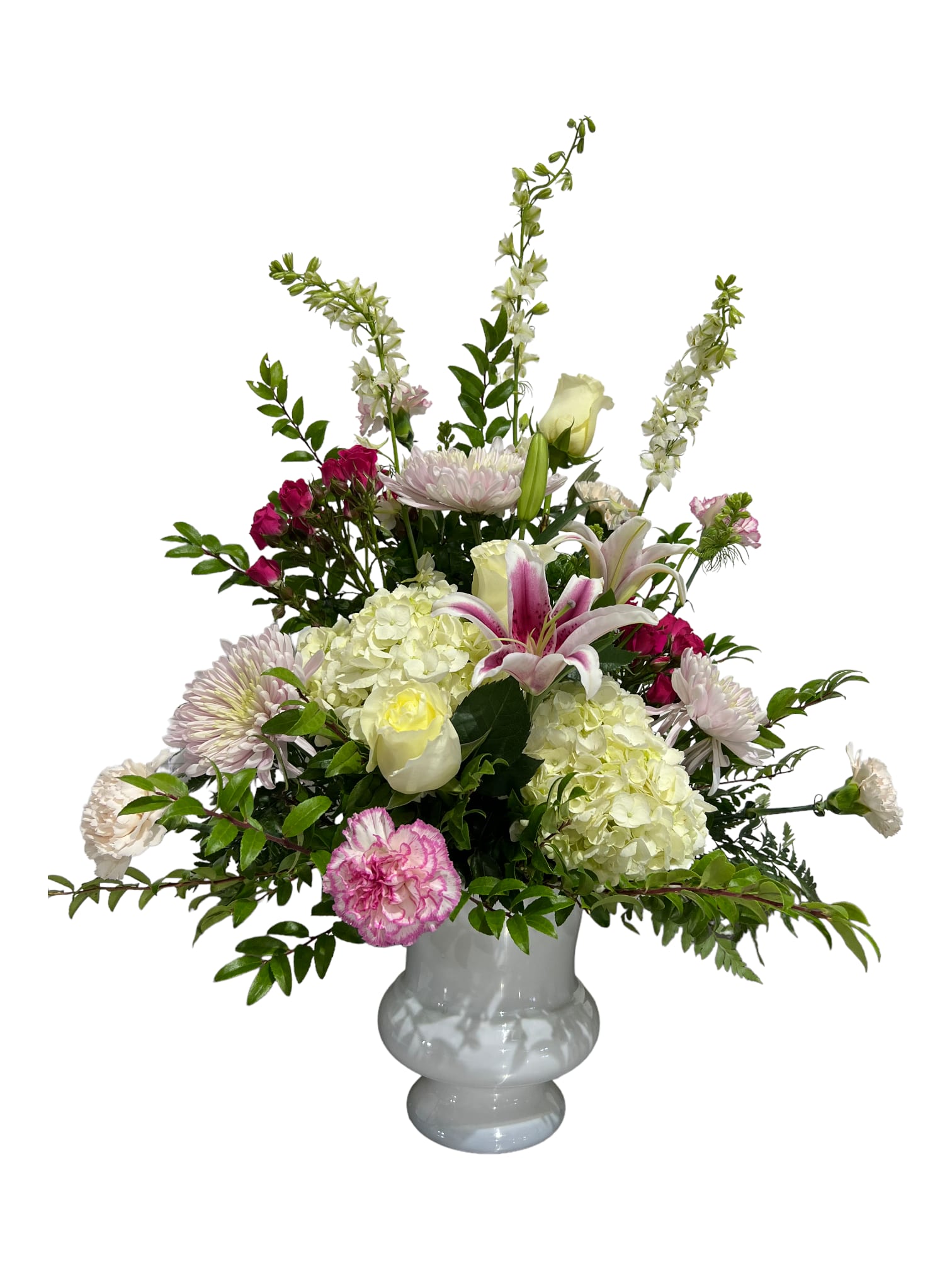 Pink and white mixed flower arrangement in a white vase