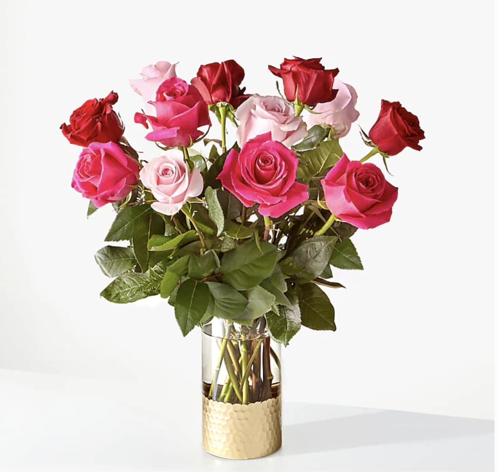 Bouquet of pink and red roses in a clear glass vase