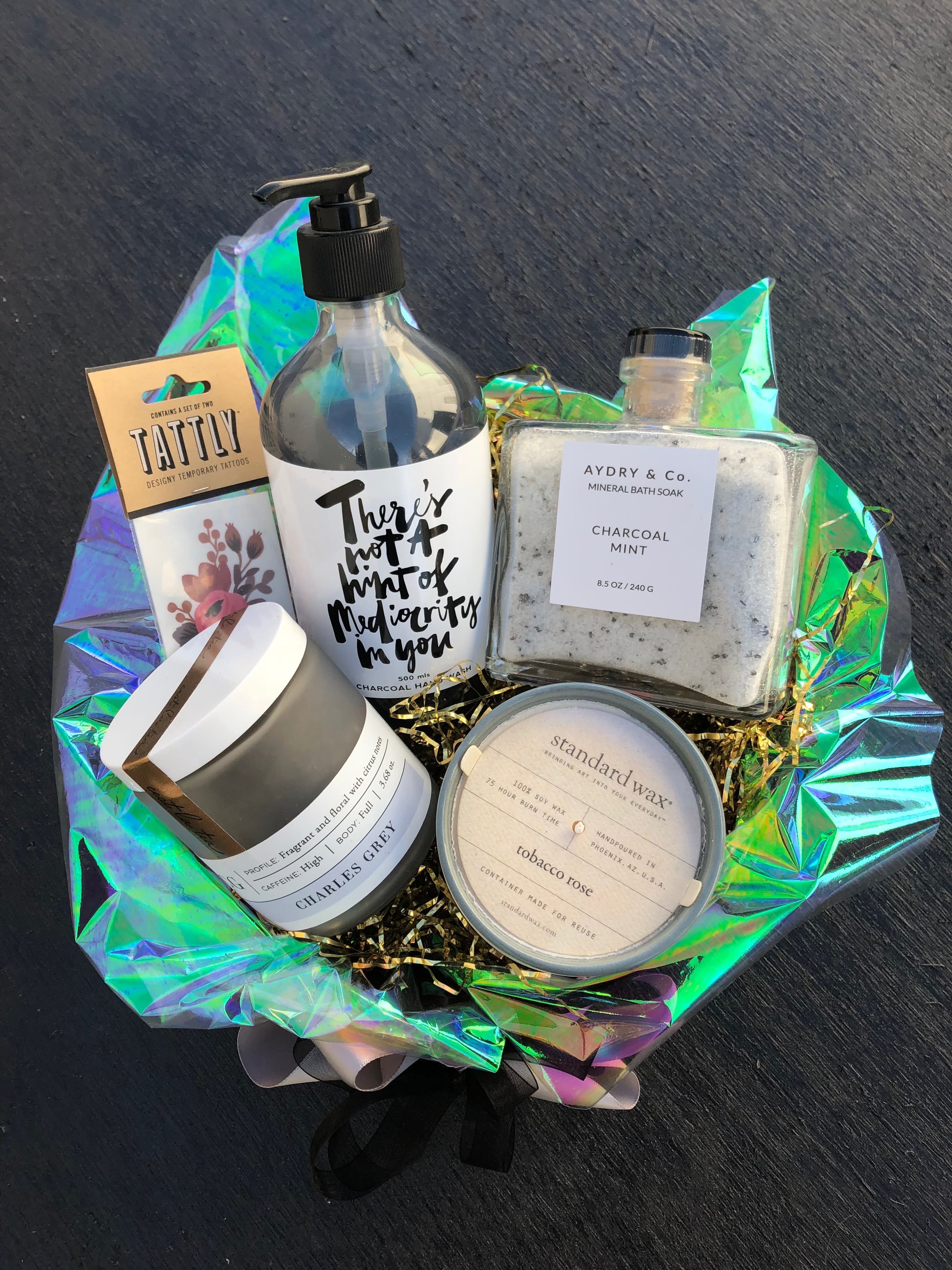 Gift basket with bath products, candle, lotion, and temporary tattoos
