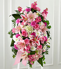 Pink and white floral standing spray with lilies and roses