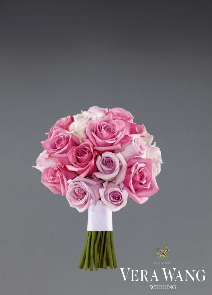 Pink and lavender rose bouquet with white wrapping