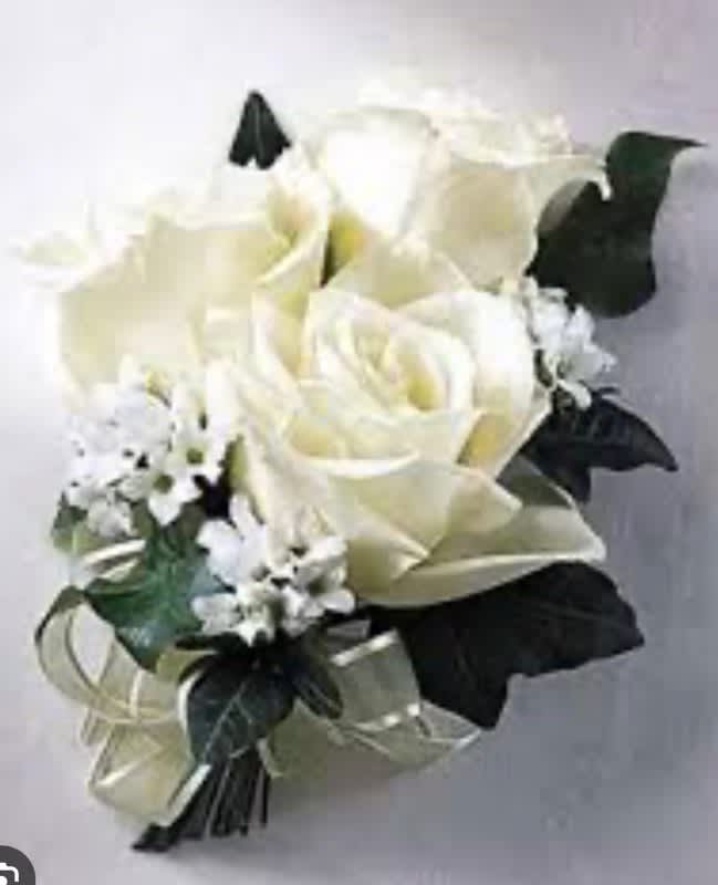 White rose bouquet with small white filler flowers and dark ribbon