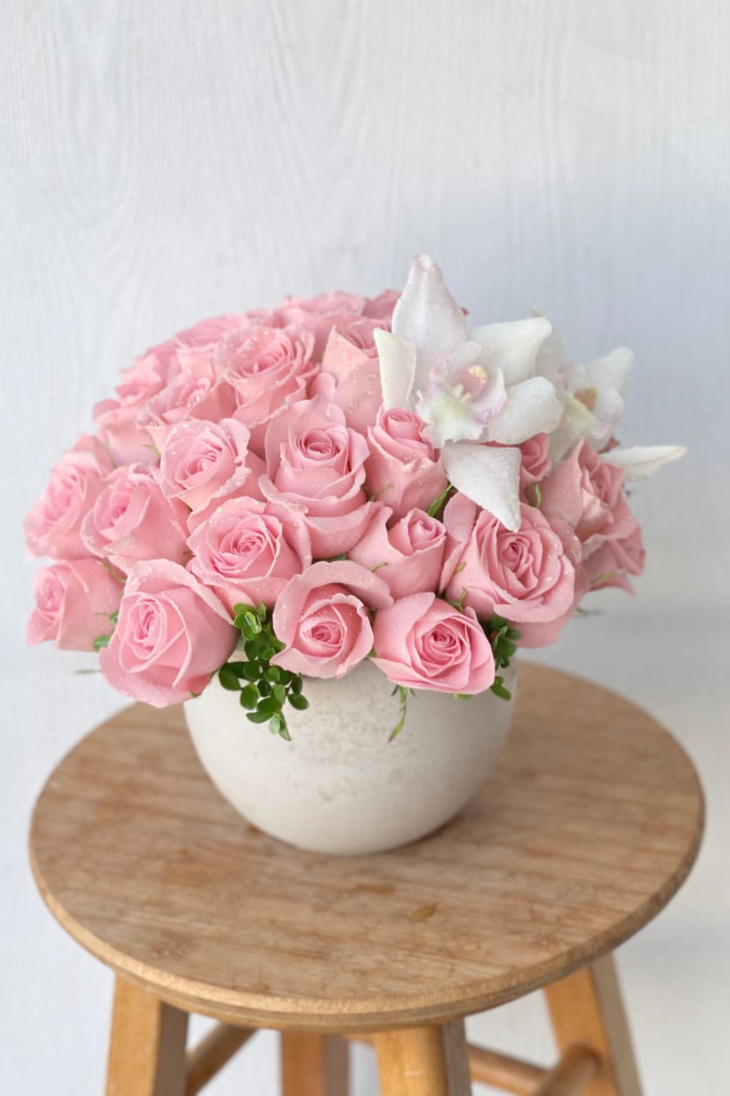 EC45 - Blush Orchid Elegance - Blush Orchid Elegance –  Roses and Orchid Arrangement | Flower Delivery in Tustin, Irvine Soft, romantic, and effortlessly luxurious, Blush Orchid Elegance is a stunning flower arrangement designed to make a lasting impression. Featuring three dozen premium soft pink roses artfully arranged in a lush, rounded dome, this design is accented with delicate white orchid blooms for an elevated, modern touch.  Handcrafted by Everyday Creations, this arrangement blends timeless beauty with contemporary style—perfect for anniversaries, birthdays, romantic surprises, or special occasions.  Designed in a chic ceramic vase and finished with fresh greenery, each piece reflects exceptional floral artistry and attention to detail. Same-day flower delivery available in Tustin, Irivne ,Newport Beach, Costa Mesa, and nearby Orange County cities  Send a message of love and beauty withBlush Orchid Elegance  – exclusively from Everyday Creations, your trusted local florist in Tustin, CA. Order online today for fast, hand-delivered floral service you can count on.  