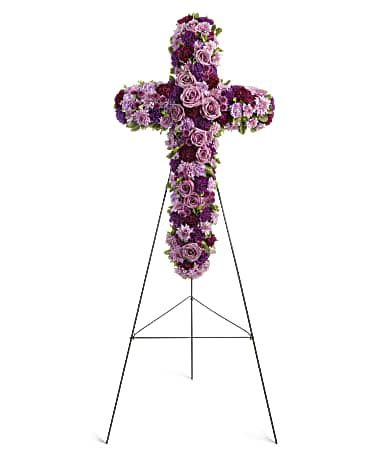 Purple floral cross on a metal easel