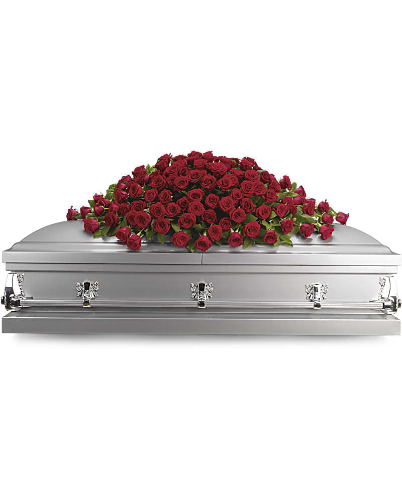 Red rose casket spray on a silver casket