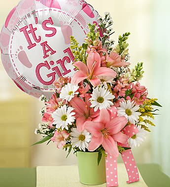 Little Princess Bouquet - EXCLUSIVE Their little princess has arrived. Welcome her into the world -- and congratulate the proud parents -- with a beautiful petite bouquet of snapdragons, lilies, alstroemeria, daisy poms and more. Artistically hand-designed by our florists in a playful green tin planter decorated with stylish pink ribbon. Charming gathering of snapdragons, lilies, alstroemeria, daisy poms, monte casino, solidago and variegated pittosporum Hand-arranged in a green tin planter they can reuse for a fresh plant or to hold baby mementos; planter measures 4.75"H Accented with a stylish pink polka dot ribbon Large arrangement measures approximately 11"H x 8"W Small arrangement measures approximately 9"H x 6"W Our florists select the freshest flowers available so floral colors and varieties may vary