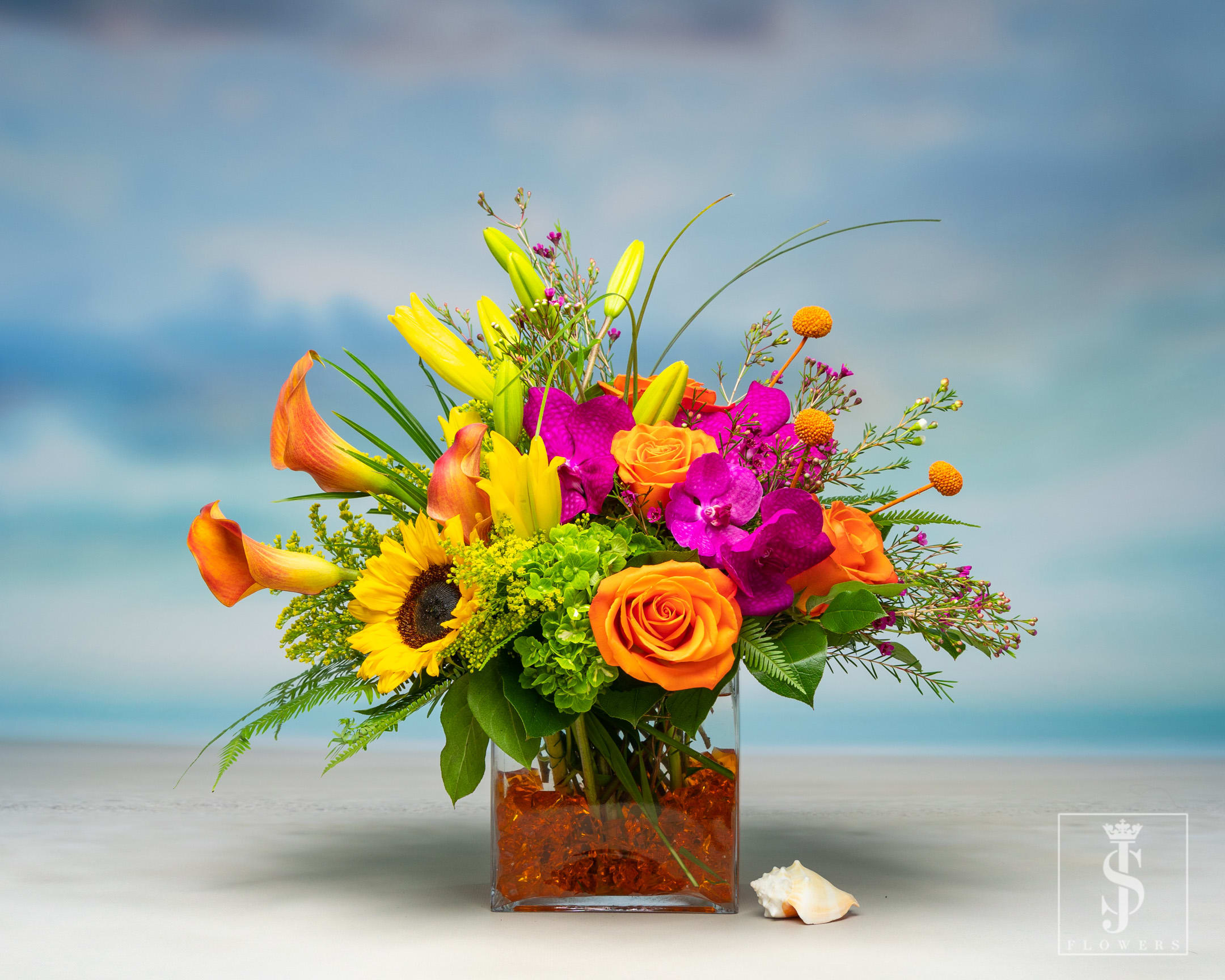 Dallas Sunrise - Wake up to a beautiful bouquet of Hydrangeas, Lilies, Orchids, Sunflowers, and Roses in colors that reflect the gorgeous Dallas sunrise. 